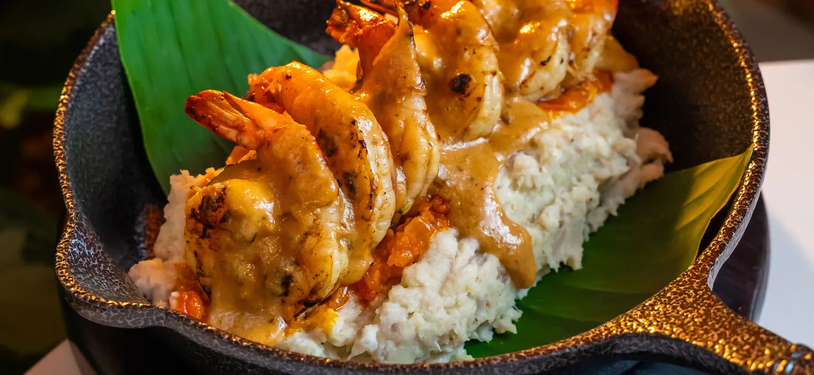 Prawns in sauce over purée