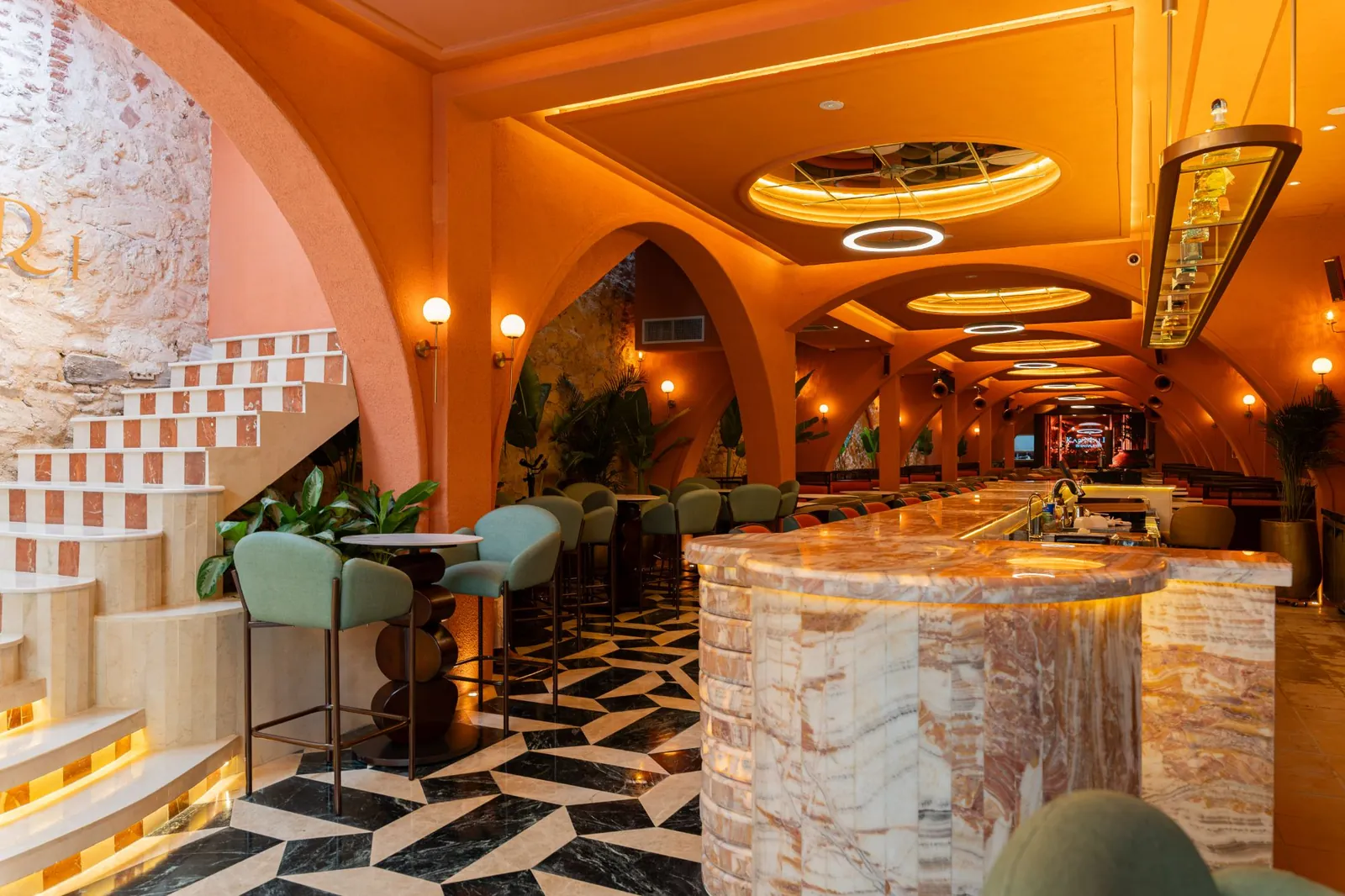 Staircase and bar next to the colonial stone wall